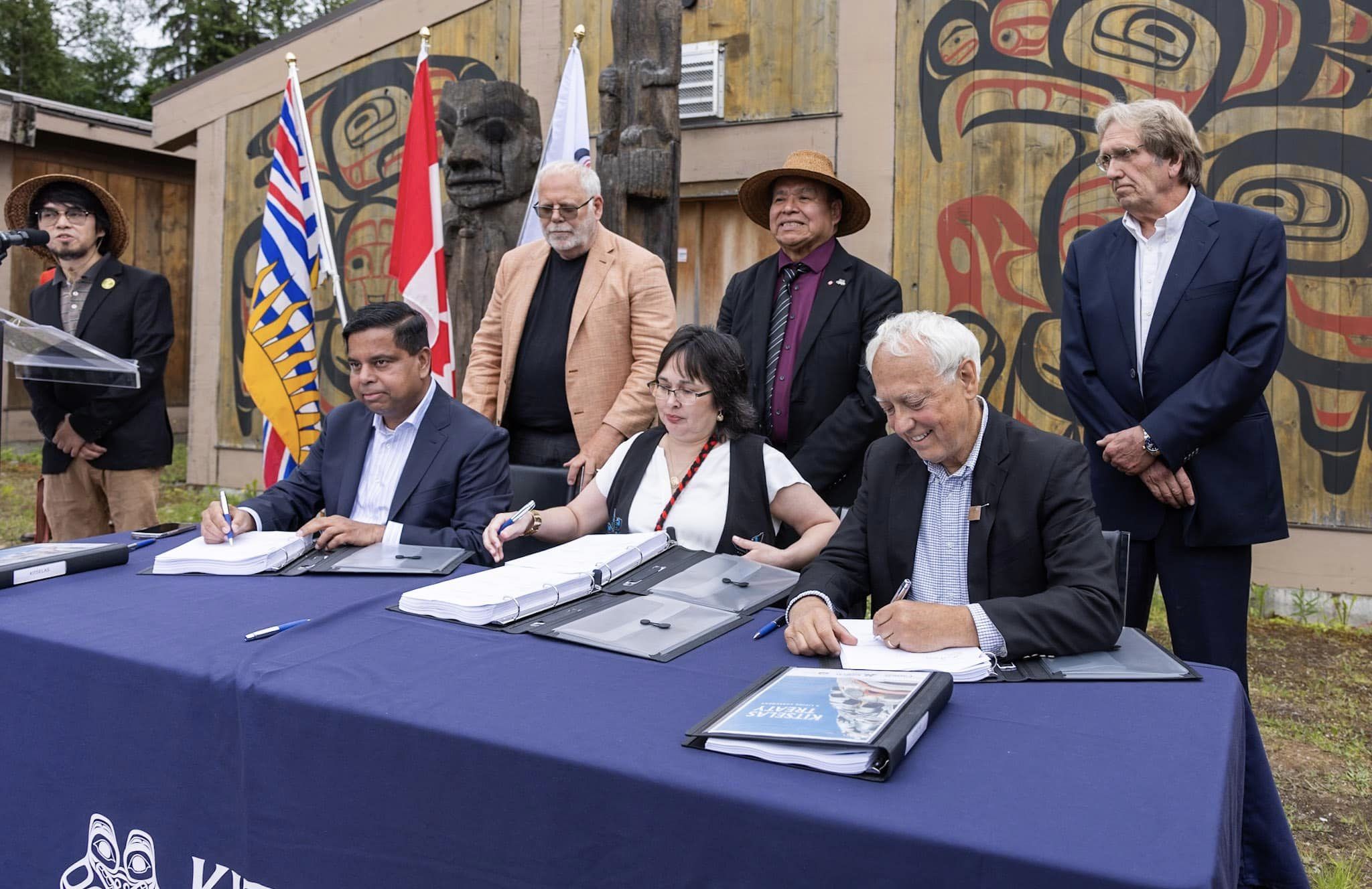 Assembled leaders and elected officials sign landmark agreement with two First Nations