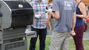 Nathan Cullen participates in a community barbecue